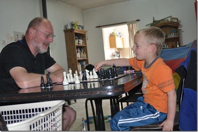 Joni and daddy playing chess