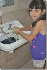 Child washing clothes