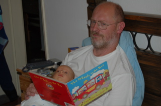 Martin reading a book with Joni