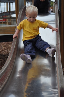 Joni going down slide