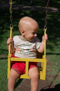 Joni on swing in plaza