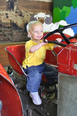 Joni riding tractor